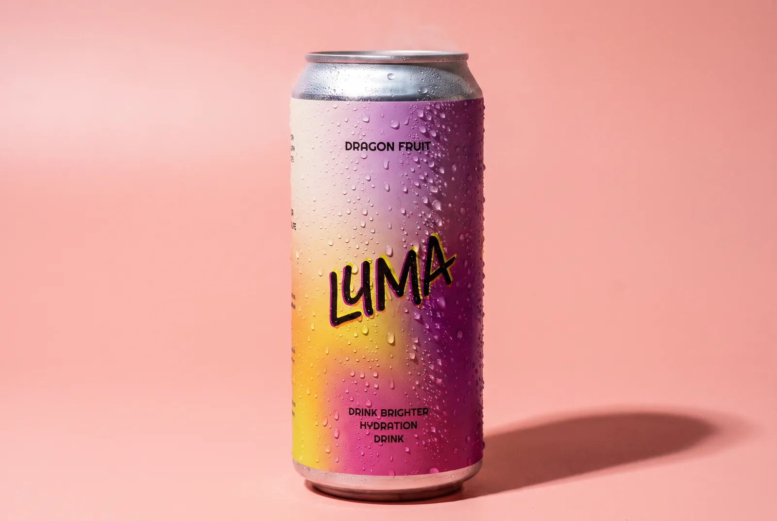 A Luma can covered in condensation on a pink ground
